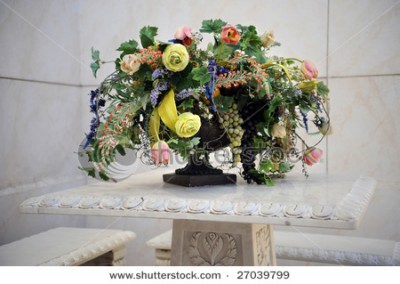 stock-photo-a-beautiful-bouquet-of-colorful-flowers-and-grapes-on-a-white-table-and-setting-27039799.jpg